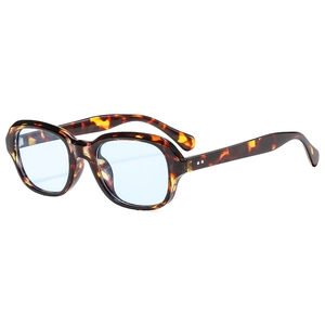 Retro oval sunglasses with tortoiseshell frames and transparent light blue lenses