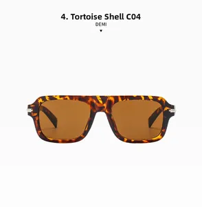 Détail de lunettes de soleil carrées en écaille avec double pont et verres marron