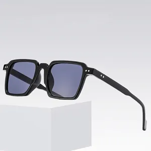 Square fashion sunglasses with black frame and silver rivets shown from a 45-degree angle
