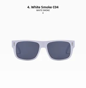 Detail einer weißen eckigen Sonnenbrille mit grauen Gläsern und silbernen Metallnieten