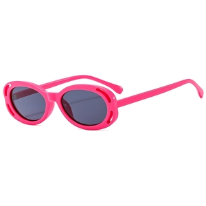 Pink oval sunglasses with hollowed-out frames and grey lenses in Y2K cyberpunk style