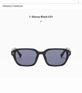 Macro detail of glossy black resin sunglasses frames with silver metal rivet accents