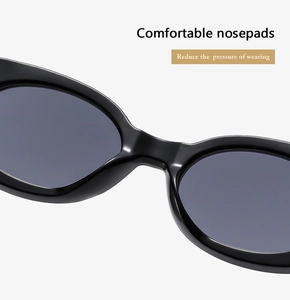 Detail of integrated comfortable nose pads on black retro oval sunglasses frame