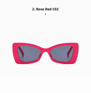 Detail view of rose red matte rectangular sunglasses with grey resin lenses