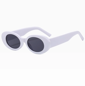 Side view of white oval sunglasses featuring thick frames and dark UV protection lenses