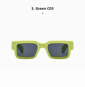 Close-up of lime green rectangular sunglasses with silver arrow detail and grey lenses