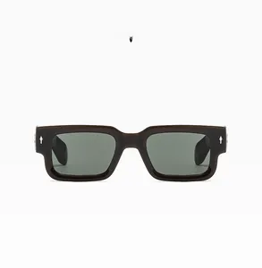 Macro view of coffee brown thick frame sunglasses with silver rivet detail and green lens