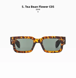 Close-up of retro demi square sunglasses with thick frames and metal rivet accents