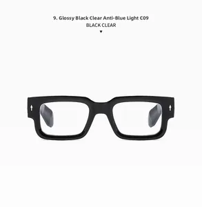 Detail of glossy black thick square frame sunglasses with silver stud accents and clear lenses