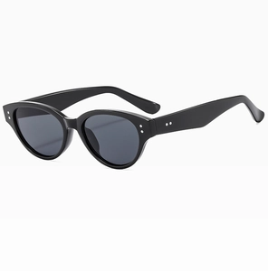 Detail of black cat-eye sunglasses featuring silver metal rivets on a glossy frame