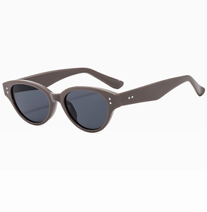 Detail of vintage cat-eye sunglasses with tortoiseshell frame and silver rivets