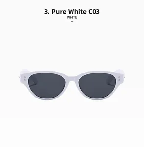 Close-up of solid white cat-eye sunglasses frames with dark gray lenses and metal dots