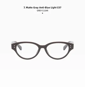 Close-up of grey cat-eye frames with silver rivets and anti-blue light clear lenses