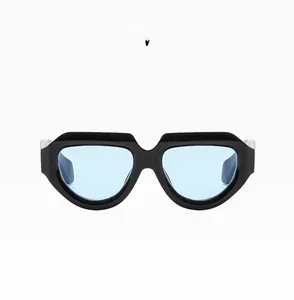 Detail of trendy black oval sunglasses with blue lenses and wide temples C06