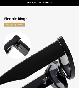 Detail view of high quality black cat eye sunglasses showing flexible metal hinge and glossy finish