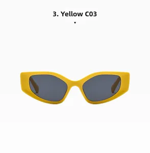 Detail of yellow irregular geometric sunglasses with dark grey lenses and chunky frame