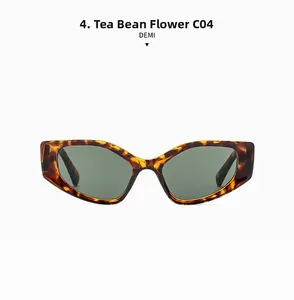 Front view of tortoise shell cat-eye sunglasses with dark green lenses and thick frames