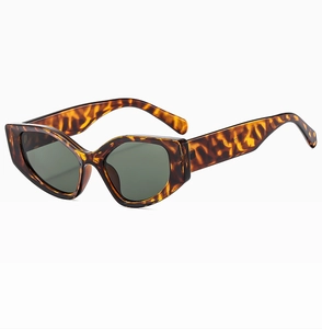 Macro view of trendy tortoiseshell cat-eye sunglasses with thick leopard print frames