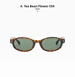 Détail de lunettes de soleil ovales écailles C04 avec verres vert foncé et rivets en métal