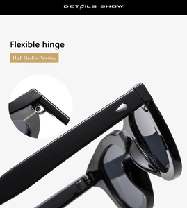Close-up of flexible metal hinge and high-quality glossy finish on black sunglasses