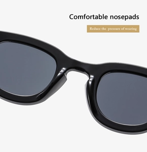 Macro view of integrated nose pads on black sunglasses for comfortable wear