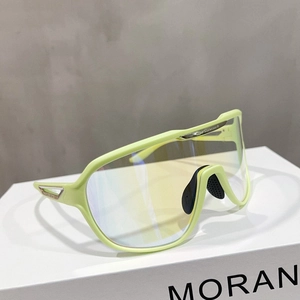 Detail of neon green sports sunglasses with metal accents and ergonomic nose pads