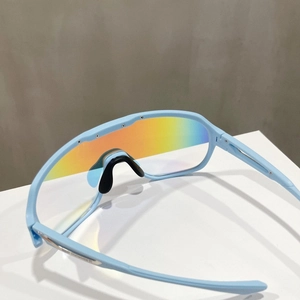 Detail of light blue sports sunglasses with colorful iridium lenses and black nose pads