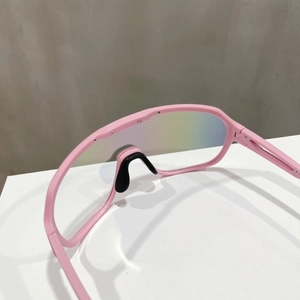 Detail of pink sports sunglasses with rainbow gradient lens and black non-slip nose pads