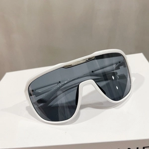 Detail of white wide-frame sunglasses with metal top bar and dark grey lenses
