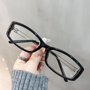 Detail view of square TR90 eyeglass frame featuring metal hinges and size specs 49-23-141