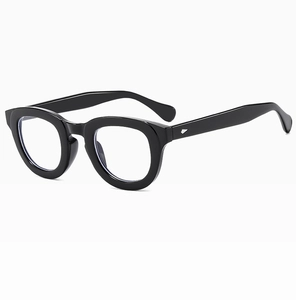 Detail of vintage thick black frame sunglasses with silver trapezoid metal accents