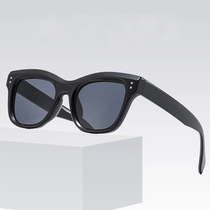 Classic black square frame sunglasses with silver rivets on a minimalist white stand