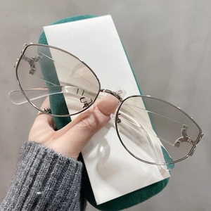 Retro cat-eye oversized sunglasses with silver metal frames and clear lenses for women