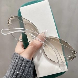 Vintage cat-eye sunglasses with silver metal frames and gradient brown lenses