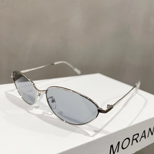 Detailed close-up of silver oval metal frame sunglasses with light blue translucent lenses