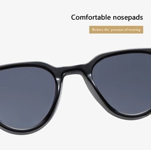 Detailed macro view of comfortable integrated nose pads on black retro sunglasses