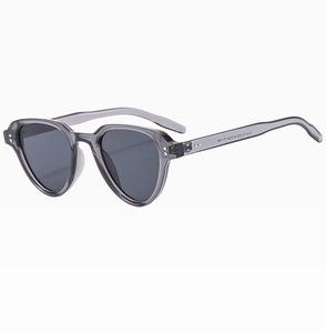 Detail of vintage square sunglasses with gray translucent frames and rivet accents