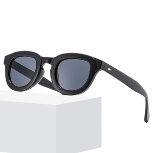 Modern minimalist black sunglasses with retro thick frame and silver triangle detail