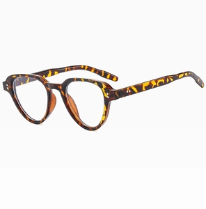 Close-up of vintage tortoiseshell eyewear frame with stylish metal rivet detail and glossy finish