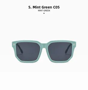 Close-up of Mint Green C05 square sunglasses with grey lenses and metal rivet details