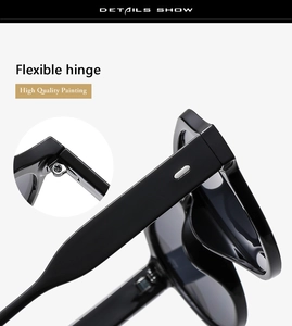 Close-up of high quality flexible metal hinge and painting on black oversized sunglasses