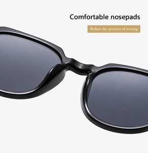 Macro detail of comfortable integrated nose pads on black oval sunglasses frame