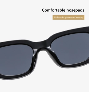 Detail of comfortable integrated nose pads on black retro round frame sunglasses