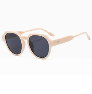 Detailed side view of vintage square cream sunglasses with sleek temples and grey lenses