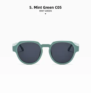 Detail view of stylish mint green oversized frames with high-quality dark grey lenses