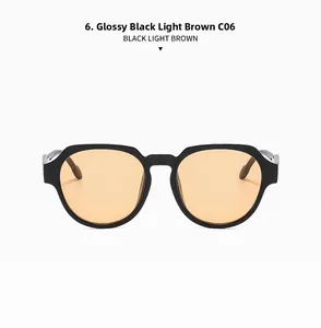 Detail view of model C06 vintage sunglasses in glossy black frame with light brown lenses