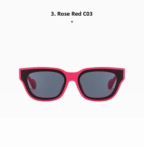 Detail view of bold rose red and black round frame sunglasses with dark grey lenses