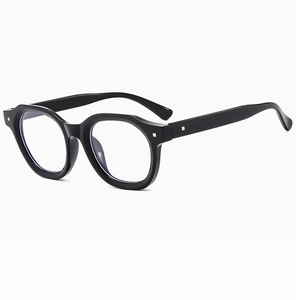 Detail shot of black punk polygonal frames with silver square metal studs for women