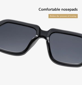 Macro view of comfortable integrated nose pads on large square black sunglasses