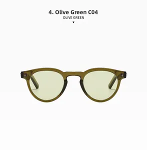 Detail view of oval olive green sunglasses featuring silver star metal ornaments